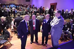 From left, Dr. Mickey Hepner, UCO, State Auditor Gary Jones, State Representitive Scott Inman, and State Senator Clark Jolley, talk in front of the stage before the start of the Annual State Budget Summit held at the Will Rogers Center, 1-28-16. - MARK HANCOCK