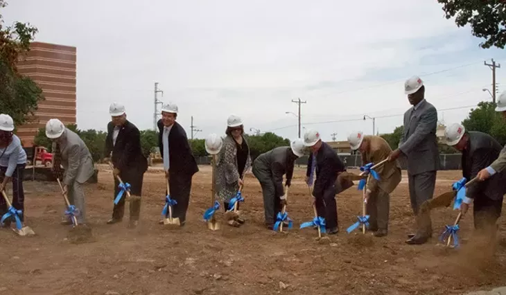 Officals with shovels breaking ground on the beginning construction of the new municipal courts building in Oklahoma City, Monday, August 3, 2015. - KEATON DRAPER