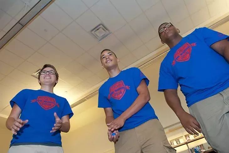 Left, Mykaela Salcido, Malachi Mills, and Darian Featherstone participate in "team juggle" exercise as part of the John Marshall High School Links program. mh