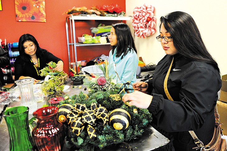 Yessica Oviedo, Jessica Rios, and Dalia Rios work in the horticulture class at Metro Career Academy in Oklahoma City, Friday, Dec. 11, 2015. - GARETT FISBECK