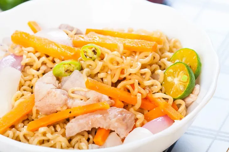 pancit canton for merienda or snacks popularize in the Philippines - BIGSTOCK