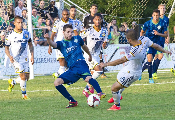 Forward Javier Castro fights for th eball on the opponents turf during the July 19th home game against LA Galaxy.Photo/Shannon Cornman - SHANNON CORNMAN