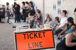 Young people with tickets for the sold out Marilyn Manson show wait in a line outside the Diamond Ballroom to be admitted, 5-15-12. mh