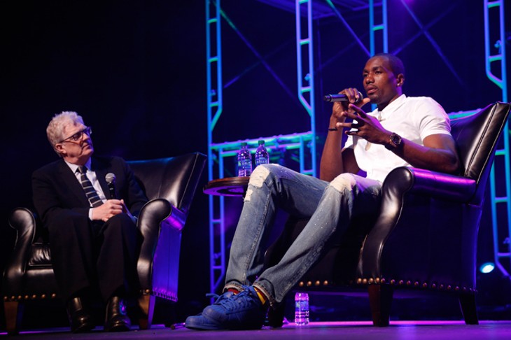 Serge Ibaka speaks with Sir Ken Robinson during the Creativity World Forum at the Civic Center in Oklahoma City, Tuesday, March 31, 2015. - PHOTO BY GARETT FISBECK