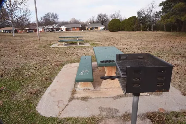 Grill and picknic tables with neighborhood beyond at McNabb Park in northeast OKC. mh