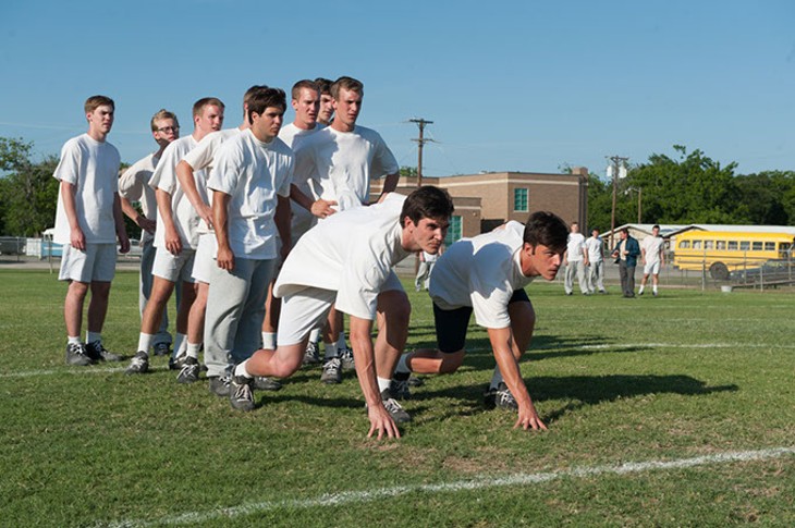 DSC_5715.NEF - Bobby Campbell (Rett Terrell) and Freddie Steinmark (Finn Wittrock) are ready to sprint against each other at their high school football practice in MY ALL AMERICAN - Date Added - 10/30/2015 6:00:00 AM - Addtl. Info - Photo credit: Van Redin/Clarius Entertainment - PHOTO CREDIT: VAN REDIN/CLARIUS