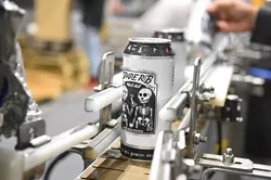 Spare Rib Pale Ale just after being sealed in it's can on the assembly line at Coop Ale Works, Oklahoma City, 2-10-16. - MARK HANCOCK