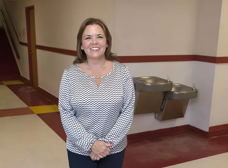 Kelley Pearson a volunteer, photographed in the hallway at Edgemere Elementary School. mh