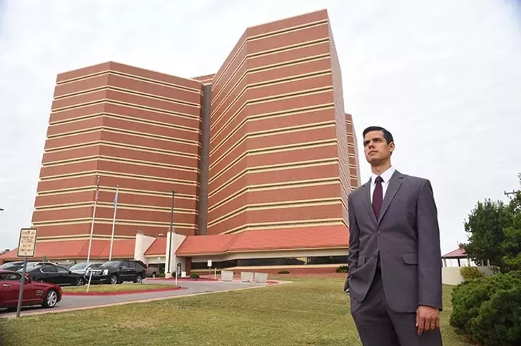 A graduate student in Harvard University's public policy program, Adam Luck, stands next to the Oklahoma County Jail, 10-8-15. - MARK HANCOCK