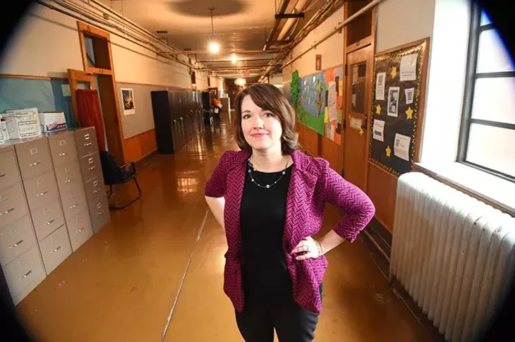 Rhonda Taylor, the OKC Public School system's director of fine arts, in the 4th floor, dimly lit hallway outside her office at the OKCPS Aministration Building. mh