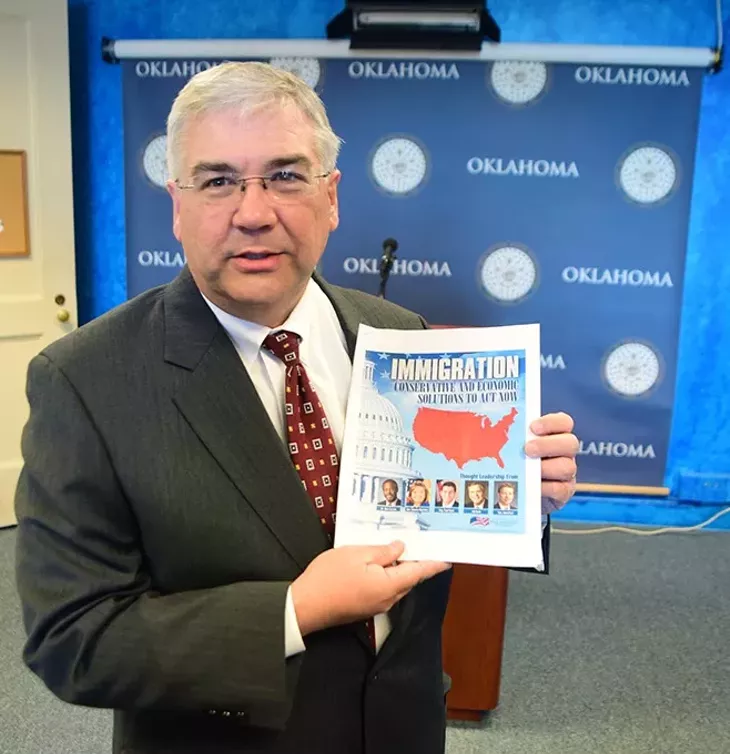 Senator Brian Cain before the start of a press conference calling for immigration reform legislation with a 16 page hand-out. (Mark Hancock)