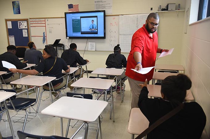 Coach and math teacher, Darwin Franklin, hands gives a test to his algebra 1 students, 10-5-15, at Millwood High School. - MARK HANCOCK