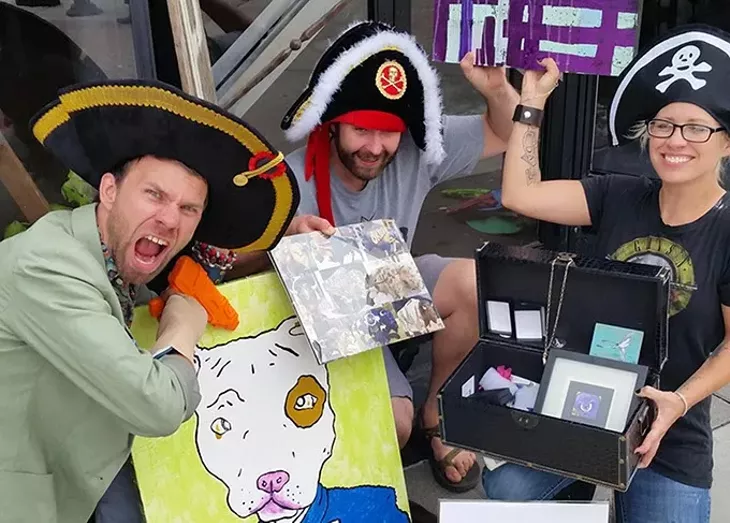 X Marks the Art's July winners show off their winnings. - PROVIDED