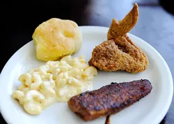 Fried chicken, macaroni and cheese, blackened catfish, cornbread roll, at Cajun King in Oklahoma City, Monday, Dec. 14, 2015. - GARETT FISBECK