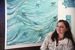 Chickasaw artist Cale Chadwick with her work "Ouzels Flying Through Water", with more of her work currently at Exhibit C. mh