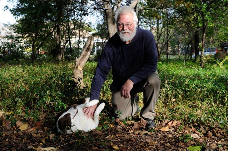 John Thompson poses for a photo with his dog, Chloe, at the site of a former crack house in Oklahoma City, Monday, Oct. 26, 2015. - GARETT FISBECK