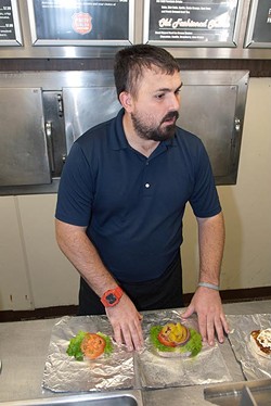 Bryce Musick preps Patty Wagon orders for customers in this 2012 file photo. (Mark Hancock / file)