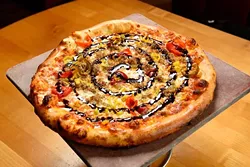 Some Like It Hot pizza at Upper Crust Pizza, Friday, March 18, 2016. - GARETT FISBECK