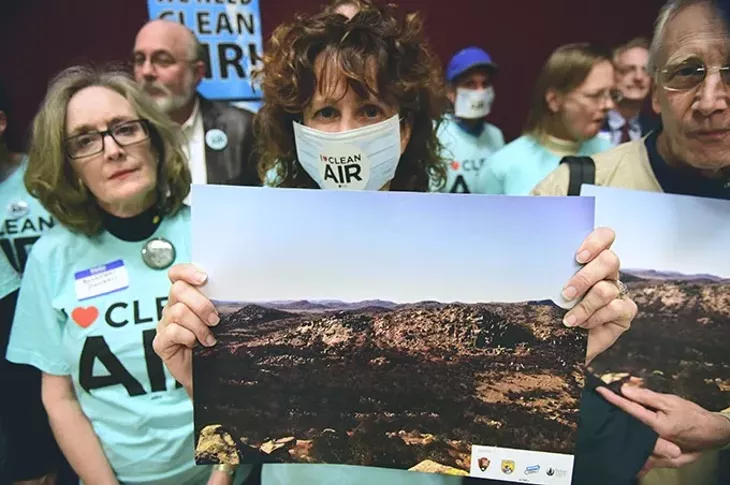 Shelly Campbell holds a photo of the Wichita Mountains with other Sierra Club members, at the news conference, Thursday, 1-15-15