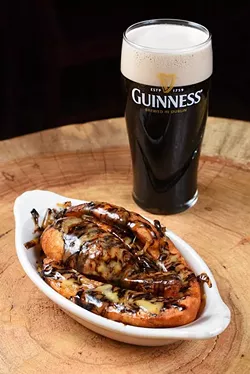 Fries with Guinness cheddar at Black Raven Pub in Choctaw, Thursday, March 3, 2016. - GARETT FISBECK