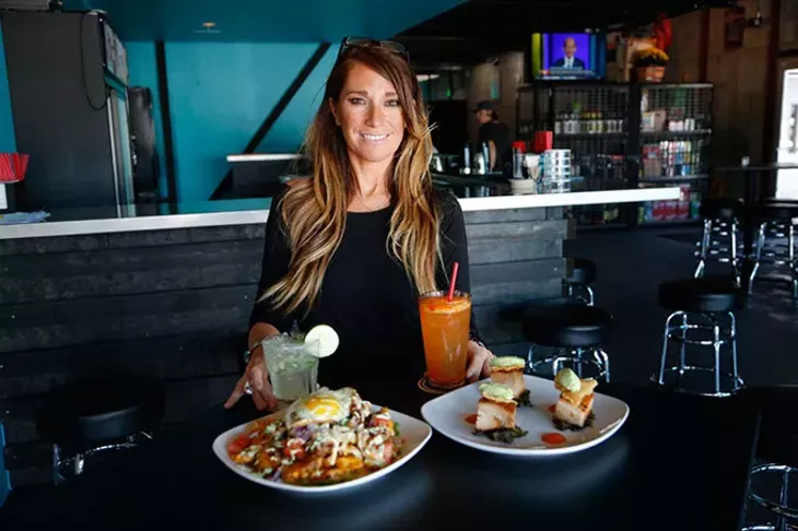 April Noriega, bartender, poses for a photo at Guyutes in Oklahoma City, Tuesday, Sept. 15, 2015. - GARETT FISBECK