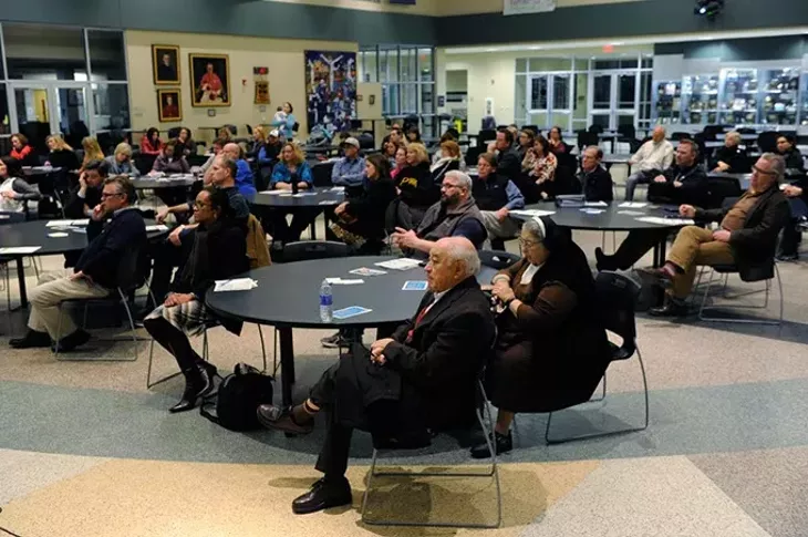 People listen during a Education Spending Accounts forum at Bishop McGuinness High School, Thursday, Jan. 21, 2016. - GARETT FISBECK