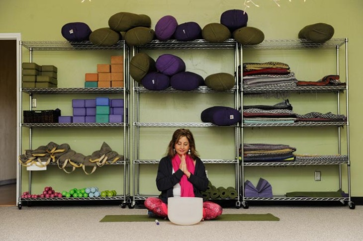 Sara Alavi leads a Yoga class at Yoga Home School of Therapeutics in Oklahoma City, Friday, March 20, 2015. - GARETT FISBECK