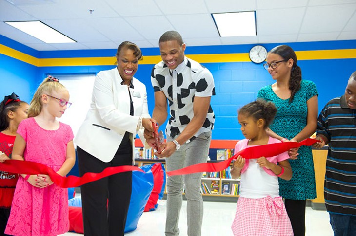 From left, Nevaeh, Lillian, principal Mrs.A.L. Jones, Russell Westbrook, Simone, Olivia and Christian. - Ribbon cutting for Russell's Reading Room.Photo/Shannon Cornman - SHANNON CORNMAN