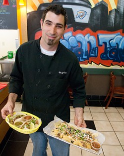 Owner/Chef Cody Hail with tacos and natchos, at The Urban Taco Shop in downtown OKC. (Mark Hancock)