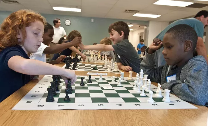 Students playing chess as part of the new chess program at Wilson Elementary, 9-23-14. mh