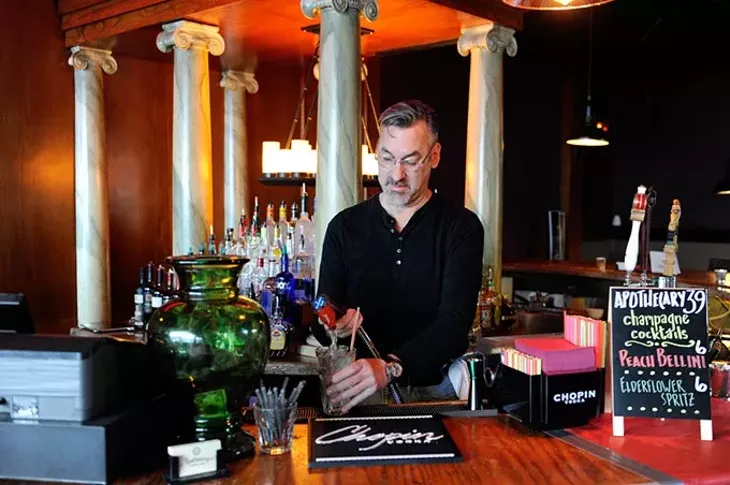 Bartender Philip Biggs makes drinks at Apothecary Thirty-Nine in Oklahoma City, Tuesday, Feb. 24, 2015. - GARETT FISBECK
