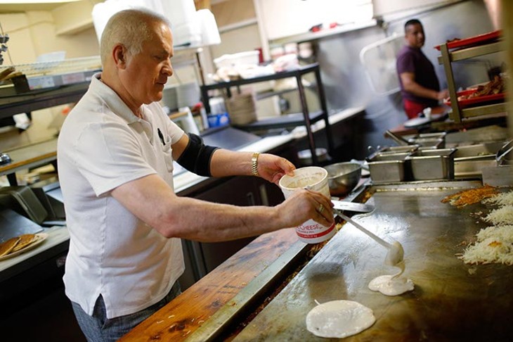 Jeff Ghandnoosh cooks pancakes at Jeff's Country Cafe in Oklahoma City, Friday, June 26, 2015. - GARETT FISBECK