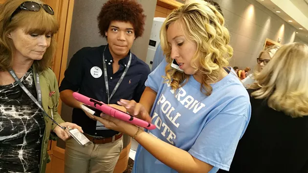 A volunteer takes straw poll votes during the first day of the Southern Republican Leadership Conference in Oklahoma City. - BEN FELDER