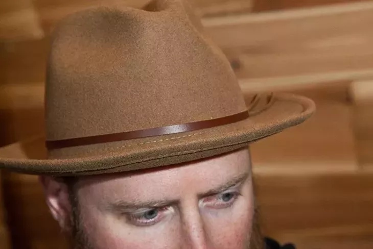 Headware like this hat, modeled by Hunter Goodman will be featured at Trade Men's Wares. - MARK HANCOCK