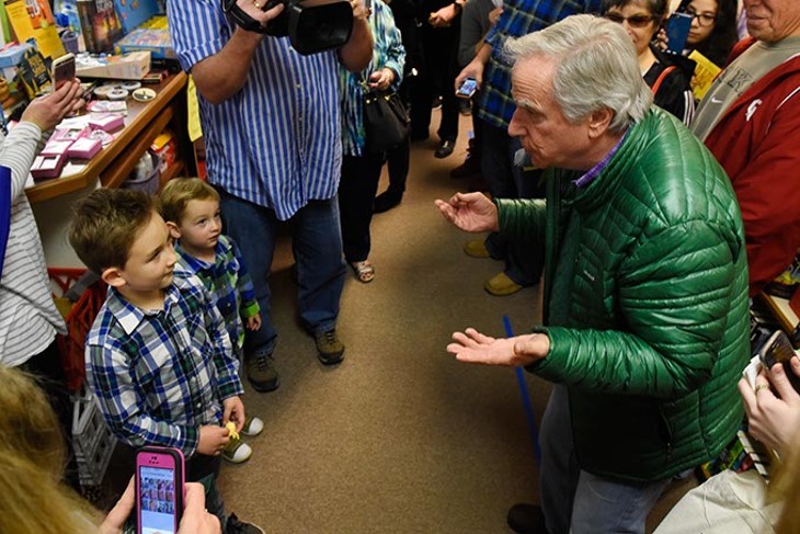 Henry Winkler does a magic trick for Owen and Henry Armstong, 6 and 2, at Best of Books in Edmond, Thursday, March 17, 2016. - GARETT FISBECK