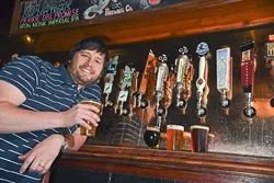 Greg Powell, TapWerks Ale House GM, with samples of local and area beers available during this years Craft Beer Fest, at TapWerks.