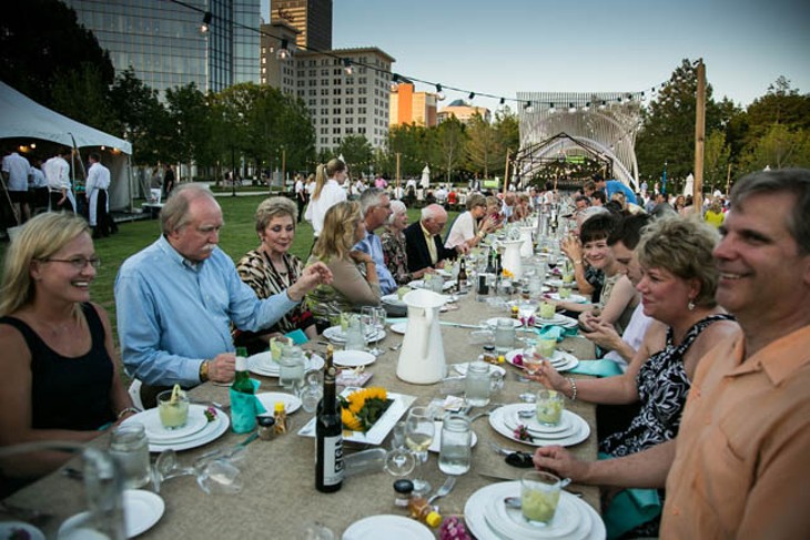 Guests enjoy a beautiful view and meal on the Myriad Botanical Gardens lawn