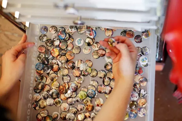 Peyton Bighorse of Skating Polly looks at buttons at Dig It! in Oklahoma City. (Garett Fisbeck)
