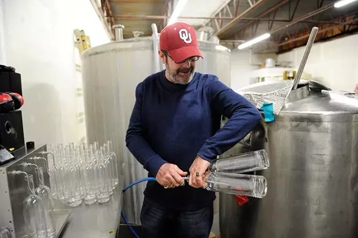 Jeff Thurmon gives a tour of Success Vodka, showing the bottling process, in Moore, Thursday, Feb. 5, 2015. - GARETT FISBECK