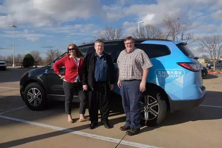 Lori Rasmussen, Nick Farlow, and Sidney Terry pose for a photo with the Embark Rideshare car in Edmond, Monday, Feb. 20, 2017. - GARETT FISBECK