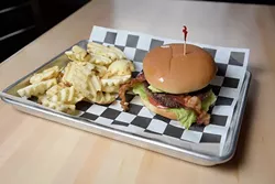 Aikman Bacon Avacado Burger with Waffle Fries at 1907 Burgers & Brews in Moore, Friday, Sept. 23, 2016. - GARETT FISBECK