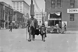 Oklahoma City, Oklahoma - Lewis W. Hine - April, 1917 - Notebook Entry: Blind man and his youthful guide. - Library of Congress Prints and Photographs Division, Washington D.C. - LIBRARY OF CONGRESS