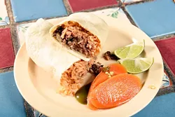Azada burrito at Carnitas Michoacan in Edmond, Thursday, May 26, 2016. - GARETT FISBECK