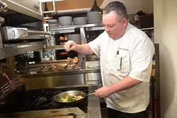 Chef Patrick Williams cooks in the kitchen at Flint, Tuesday, May 30, 2017. - GARETT FISBECK