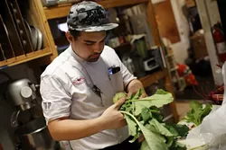 Patrick Clark prepares a meal at the Red Cup in Oklahoma City, Wednesday, May 14, 2015. - GARETT FISBECK