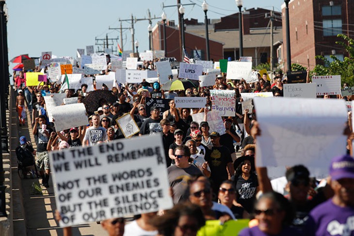 Protesters march during a Black Lives Matter demonstration in Oklahoma City, Sunday, July 10, 2016. - GARETT FISBECK