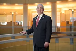 Tim Rogers, executive director of Metro Library System, poses for a photo at the Ron Norwick Downtown Library, Friday, Feb. 3, 2017. - GARETT FISBECK