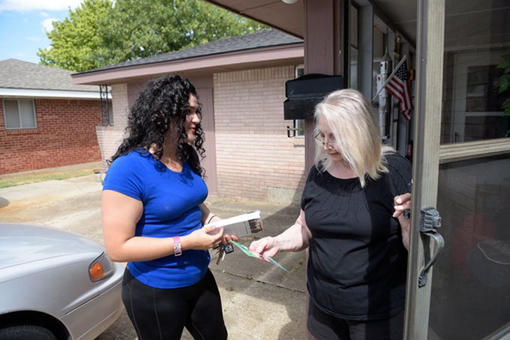 Elizabeth Larios talks with Patricia Fernandez during her visit to a Moore neighborhood. (Garett Fisbeck / file)