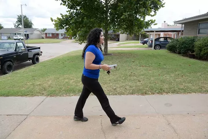Elizabeth Larios campaigns in a neighborhood in Moore, Thursday, Aug 18, 2016. - GARETT FISBECK