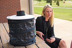 Megan Souder talks about public health concerning the Zika virus as she sits next to a mosquito trap at the Oklahoma City-County Health Department. (Photo Garett Fisbeck)